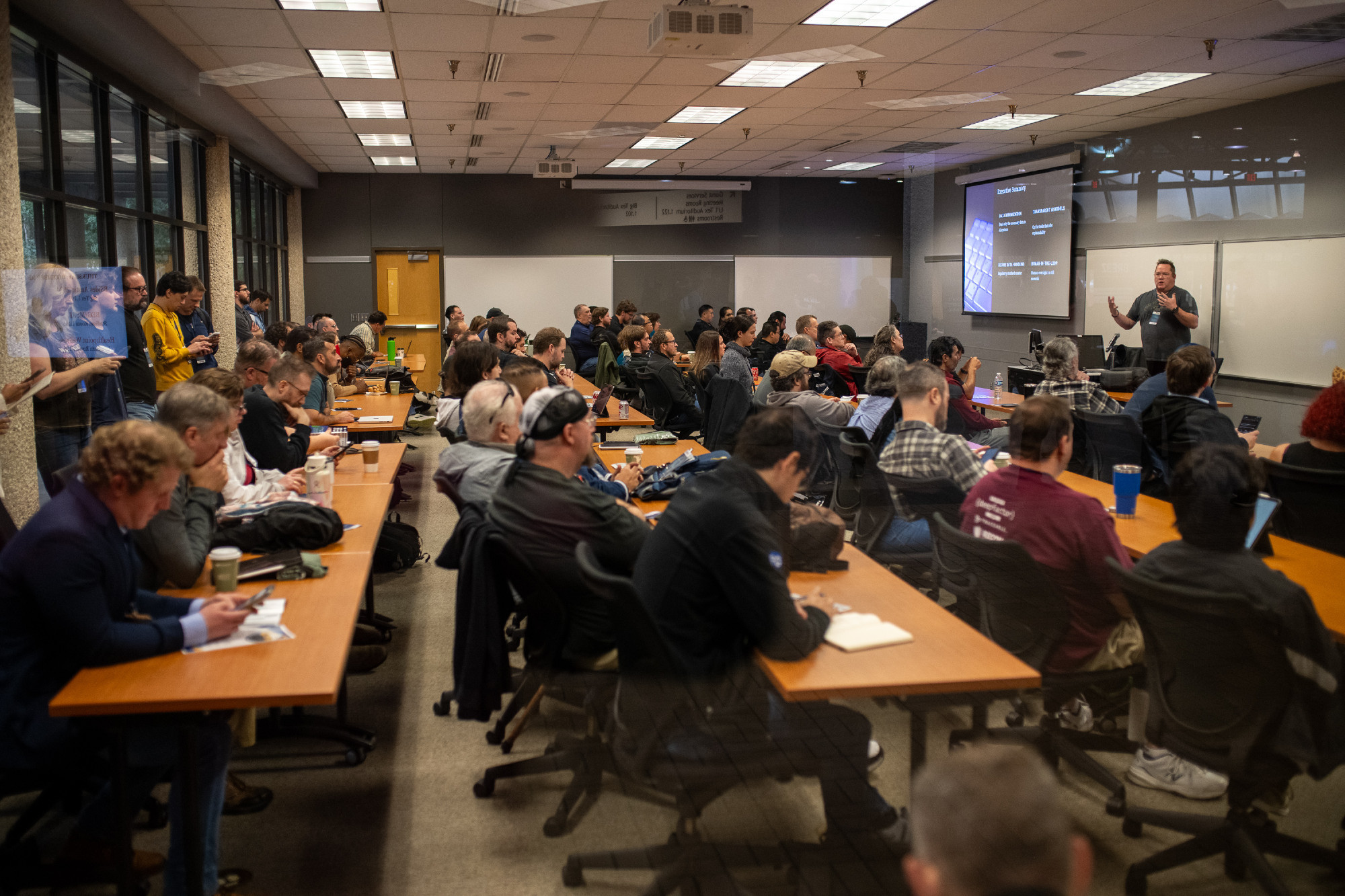A packed room of attendees for one of the talks.